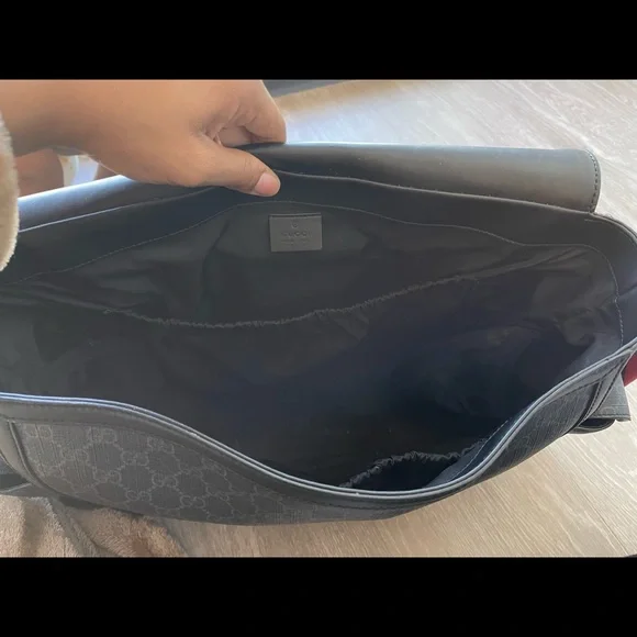 I am selling a Gucci x Supreme Diaper Bag